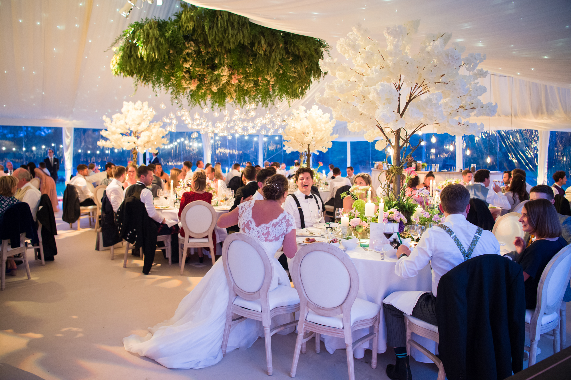 Whatley Manor marquee dressed for a wedding with guests seated at tables